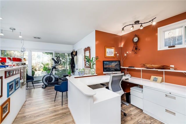 home office with light wood-type flooring