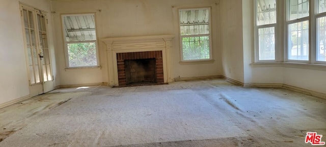 unfurnished living room featuring a fireplace