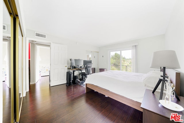 bedroom featuring dark wood-type flooring