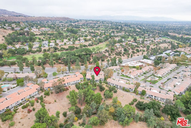 birds eye view of property featuring a mountain view