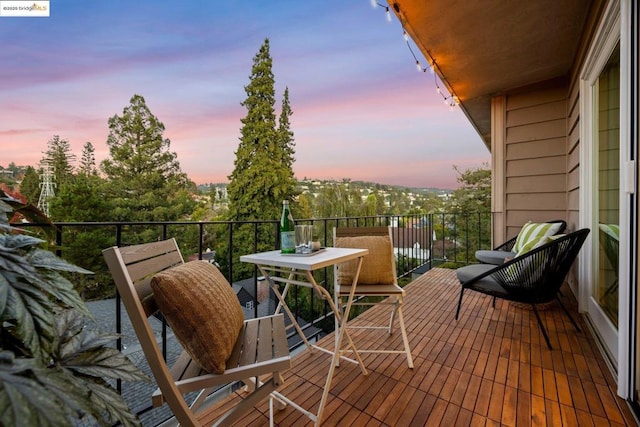 view of balcony at dusk