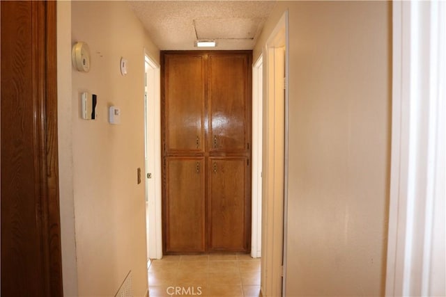 corridor with a textured ceiling