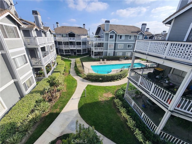 view of pool with a yard