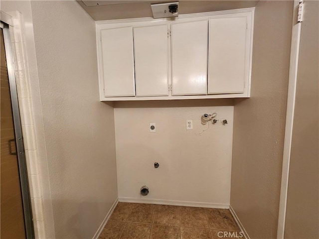 laundry room featuring cabinets, hookup for a washing machine, and hookup for an electric dryer