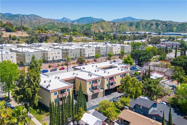 birds eye view of property with a mountain view