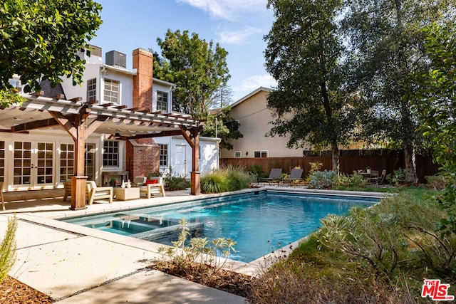 view of swimming pool featuring a patio area, an in ground hot tub, french doors, and a pergola