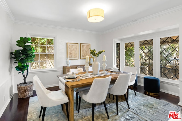 dining area featuring hardwood / wood-style floors and crown molding