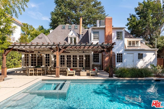 back of house with a patio, ceiling fan, a pool with hot tub, an outdoor hangout area, and a pergola