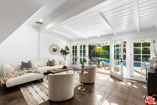 living room featuring a healthy amount of sunlight, french doors, and beamed ceiling