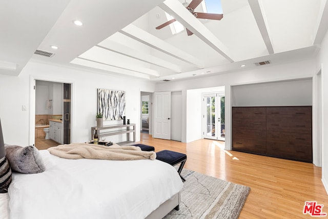 bedroom with ensuite bathroom, light hardwood / wood-style floors, ceiling fan, access to outside, and beamed ceiling