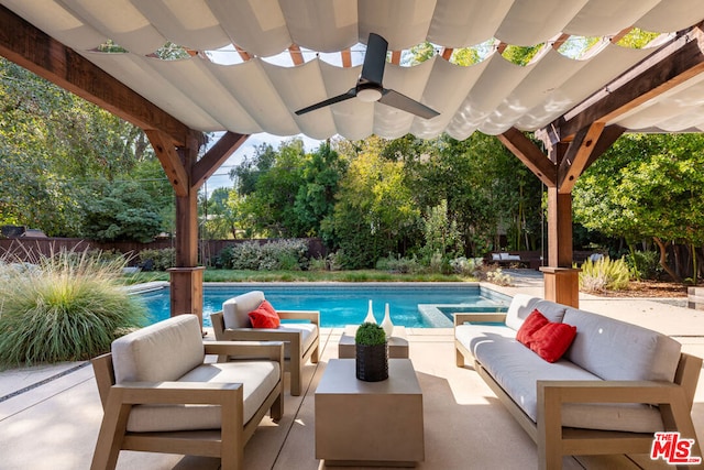 view of pool featuring ceiling fan, an outdoor hangout area, and a patio