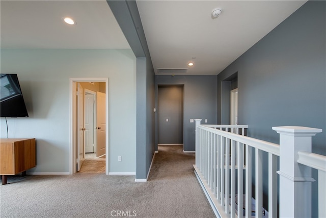 hall featuring carpet floors, recessed lighting, and baseboards