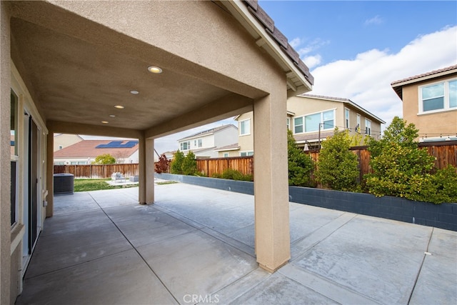 view of patio with a fenced backyard and cooling unit