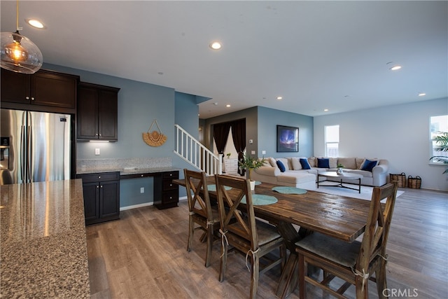 dining room with recessed lighting and wood finished floors