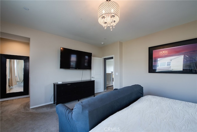 bedroom featuring carpet floors, baseboards, and a notable chandelier