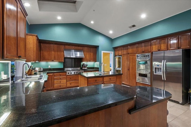 kitchen with lofted ceiling, sink, appliances with stainless steel finishes, kitchen peninsula, and exhaust hood