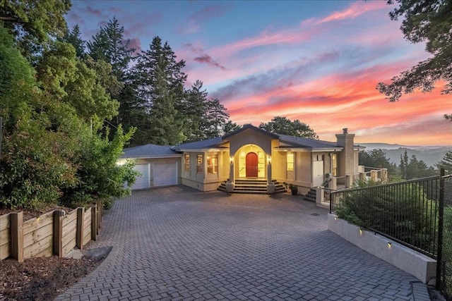 view of front of house featuring a mountain view and a garage