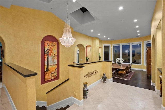 interior space with an inviting chandelier and light tile patterned floors