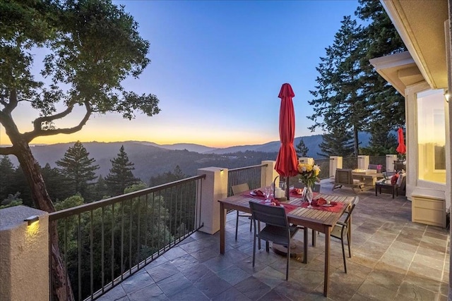 balcony at dusk with a mountain view