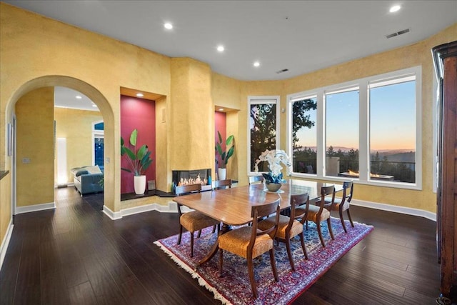 dining space featuring dark hardwood / wood-style floors