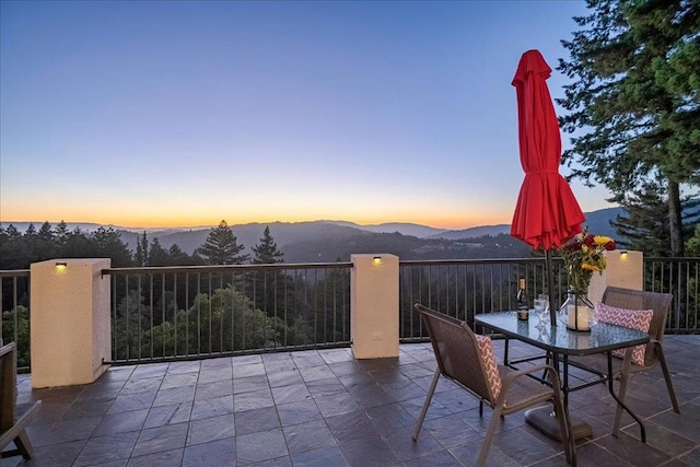 patio terrace at dusk with a mountain view