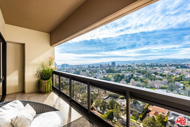 balcony featuring a mountain view