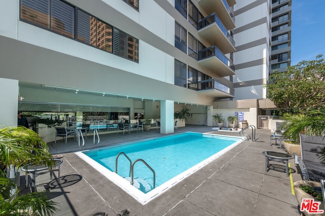 view of pool with a patio