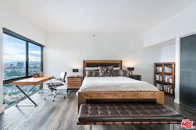 bedroom featuring dark hardwood / wood-style flooring