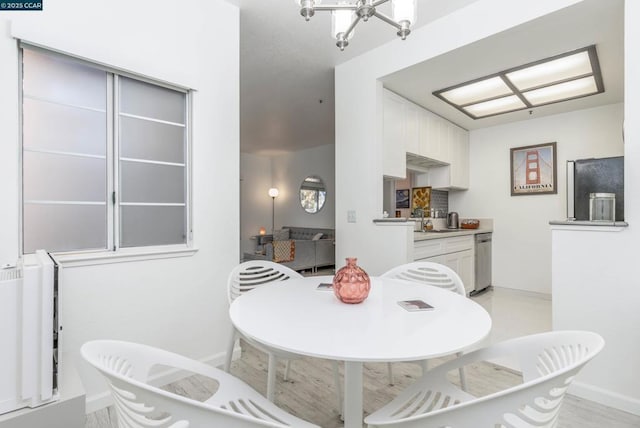 dining space with a notable chandelier