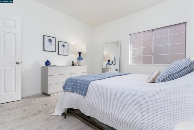 bedroom with light hardwood / wood-style floors