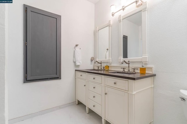 bathroom with toilet and vanity