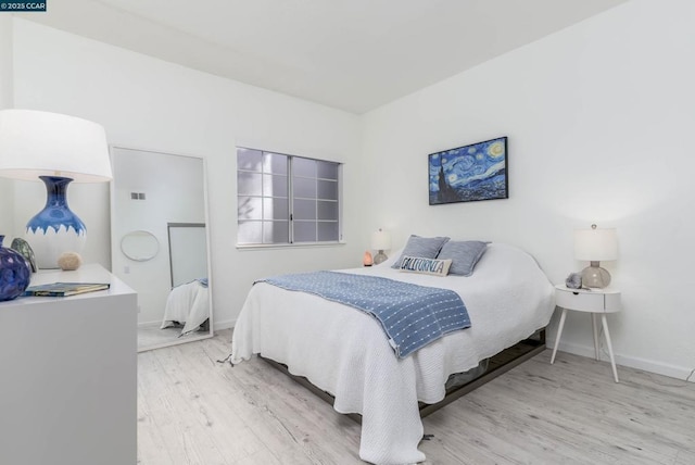 bedroom with light hardwood / wood-style flooring