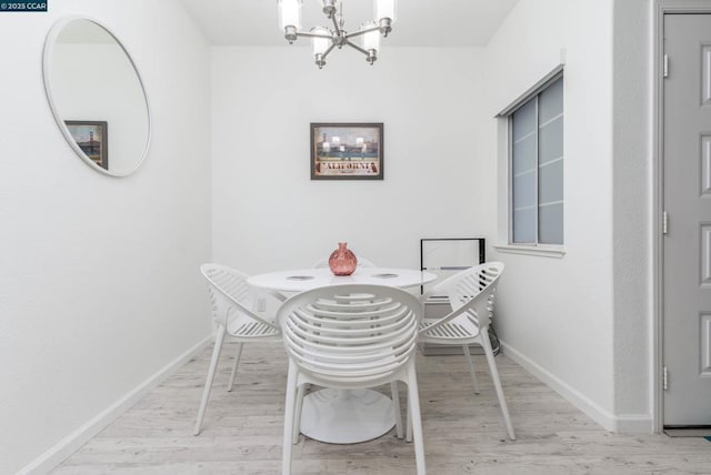 dining area featuring a notable chandelier