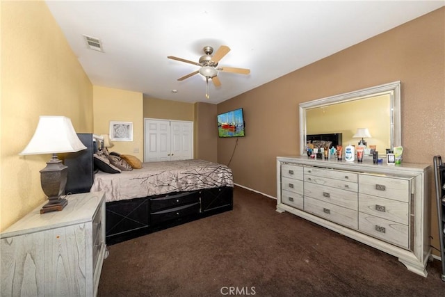 carpeted bedroom with ceiling fan and a closet