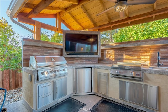 view of patio / terrace with a grill, area for grilling, and sink