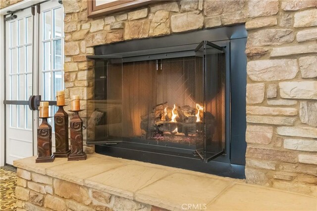 interior details with a stone fireplace