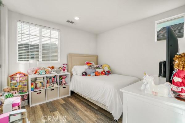 bedroom featuring dark wood-type flooring