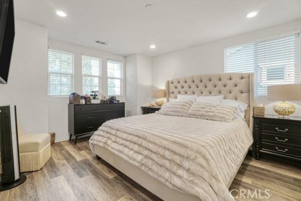 bedroom featuring wood-type flooring