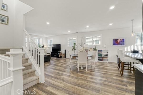 dining space featuring hardwood / wood-style floors