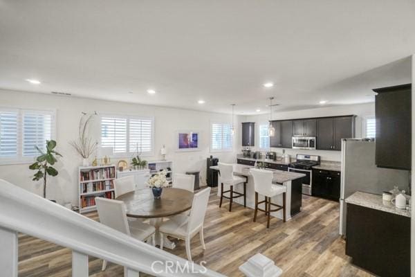 dining space featuring light hardwood / wood-style floors