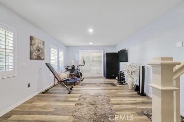 workout room with light wood-type flooring