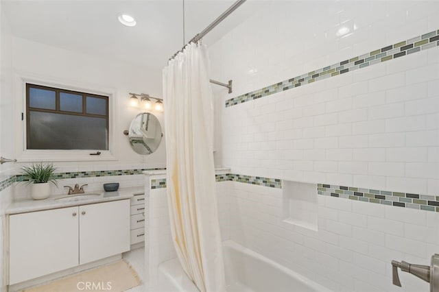 bathroom with shower / tub combo with curtain and vanity