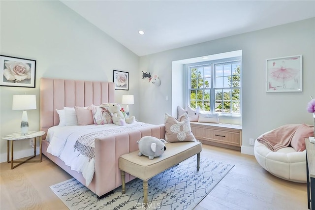 bedroom featuring vaulted ceiling and light hardwood / wood-style floors