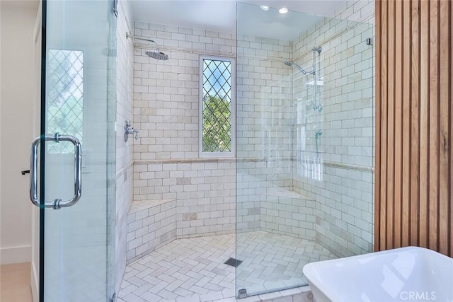 bathroom featuring shower with separate bathtub