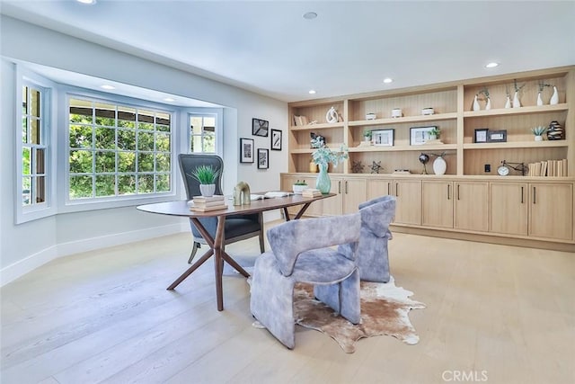 office area with light hardwood / wood-style flooring