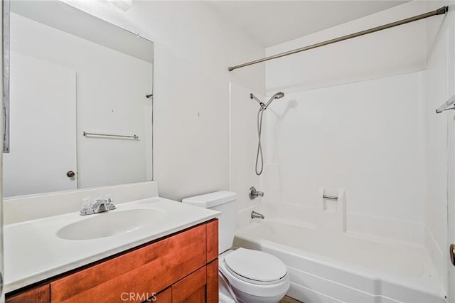 full bathroom with toilet, vanity, and shower / washtub combination