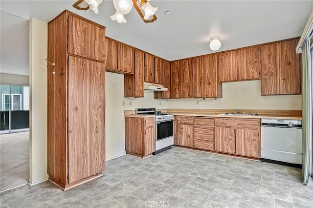 kitchen with sink and white appliances