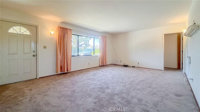 foyer with light colored carpet