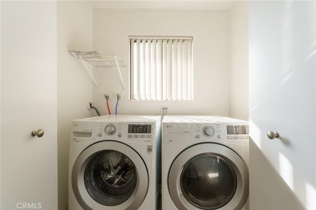 washroom featuring washer and dryer