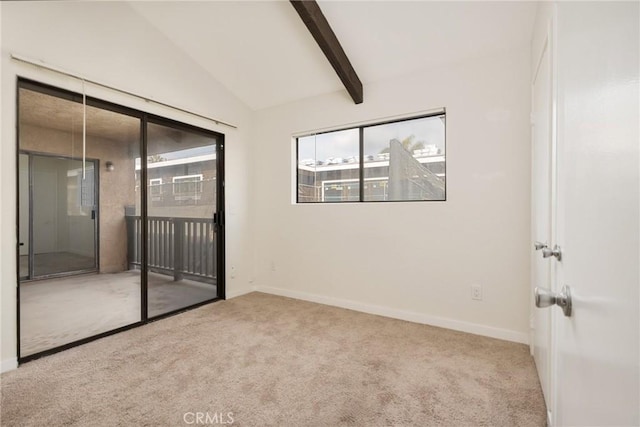 empty room with light colored carpet and lofted ceiling with beams